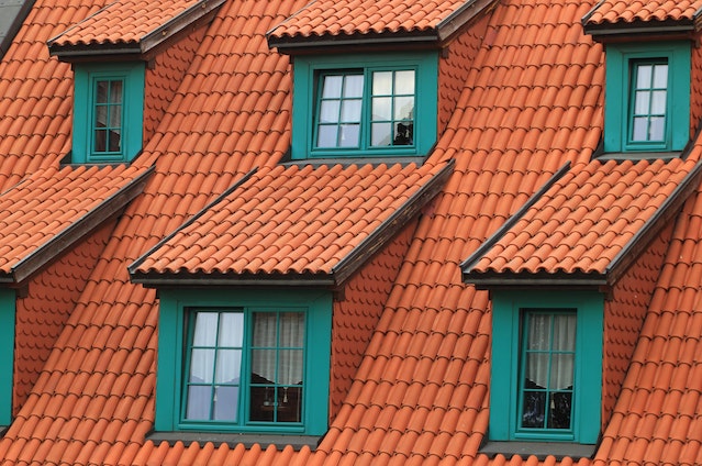 A close-up of a roof and windows.