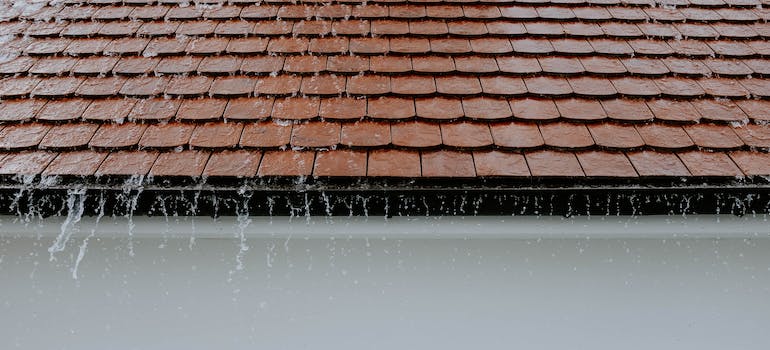 Rain sliding off of a roof.