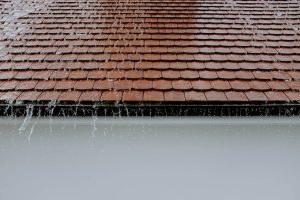 A photo of a roof during a rain.