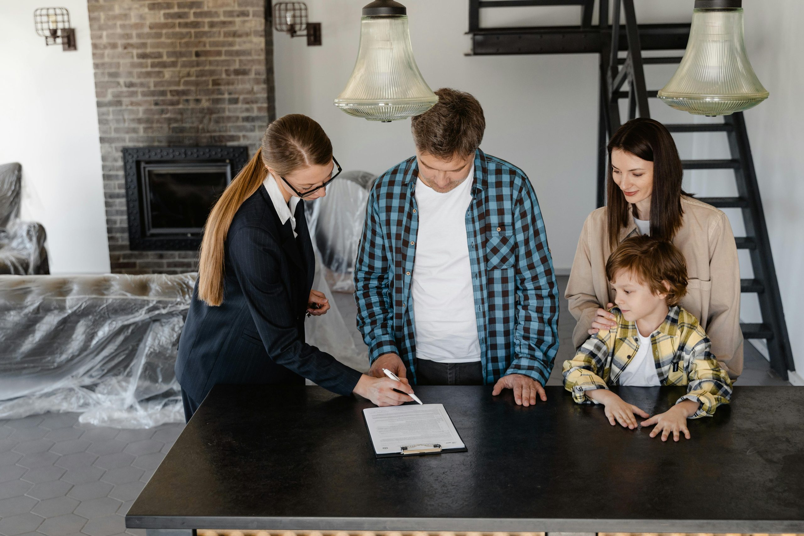 A family discussing apartment roofing insights for new tenants with their landlord in an apartment.