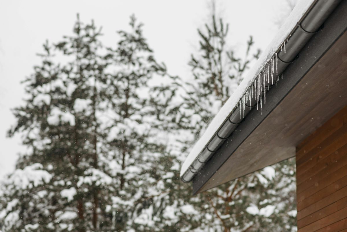 A roof with snow and ice